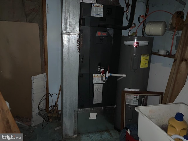 utility room featuring water heater