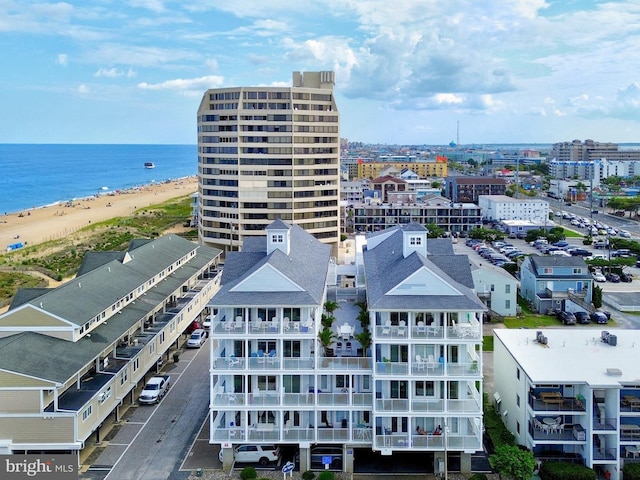 bird's eye view featuring a beach view and a water view