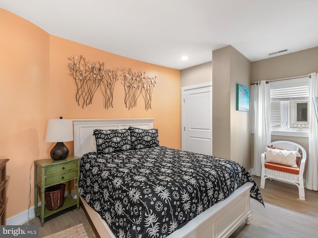 bedroom with light hardwood / wood-style floors