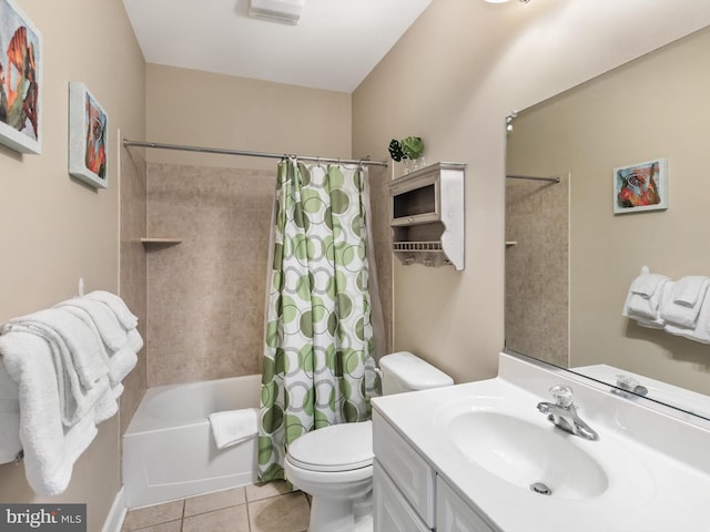 full bathroom with tile floors, toilet, vanity, and shower / bath combo with shower curtain