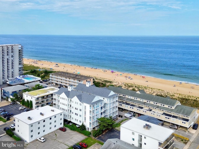 bird's eye view with a water view and a view of the beach