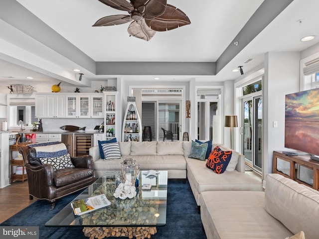 living room featuring french doors, ceiling fan, and dark hardwood / wood-style flooring