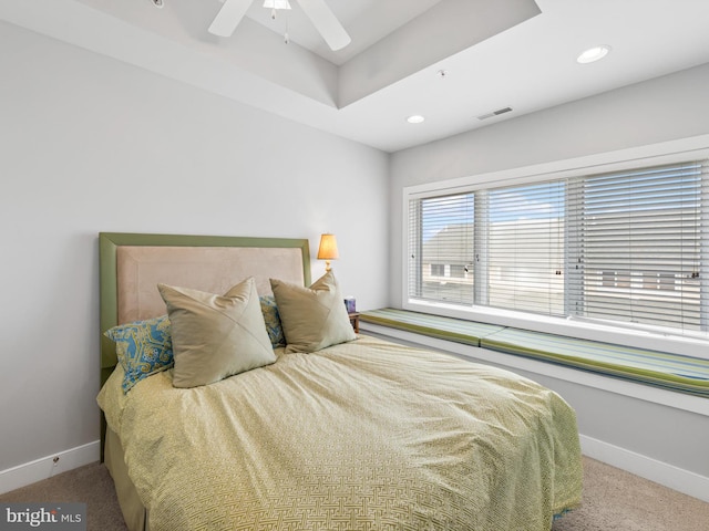 bedroom featuring light carpet and ceiling fan