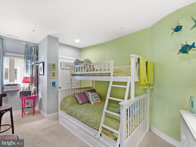 bedroom featuring light colored carpet