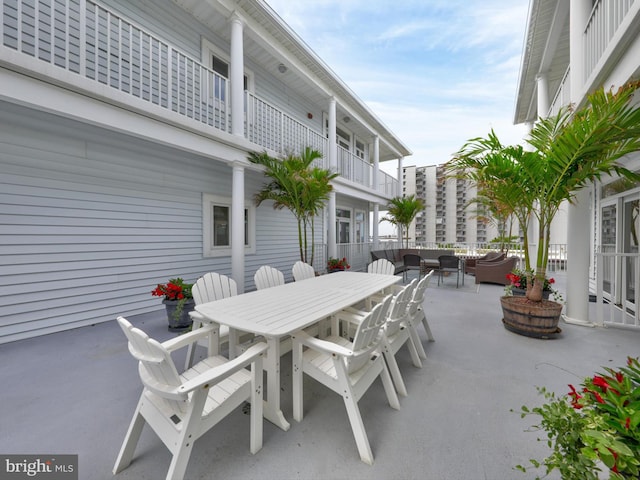 view of patio featuring a balcony and outdoor lounge area