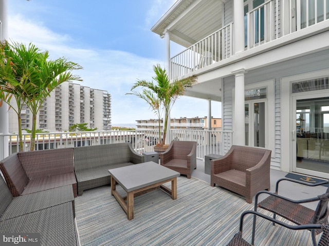 wooden deck featuring outdoor lounge area