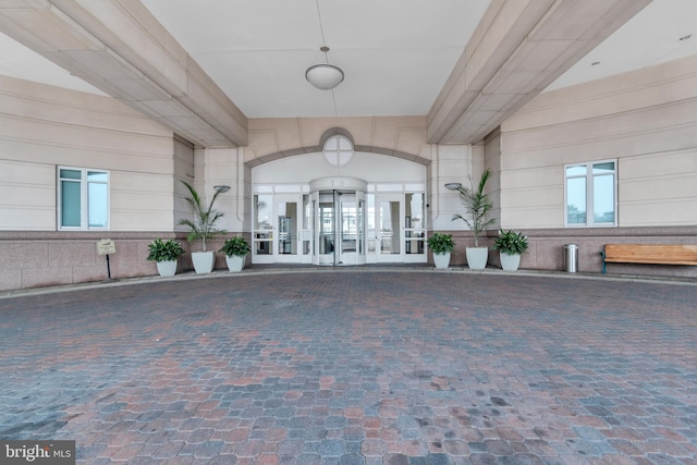 view of exterior entry featuring french doors