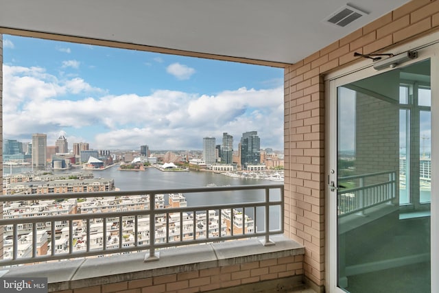 balcony featuring a water view