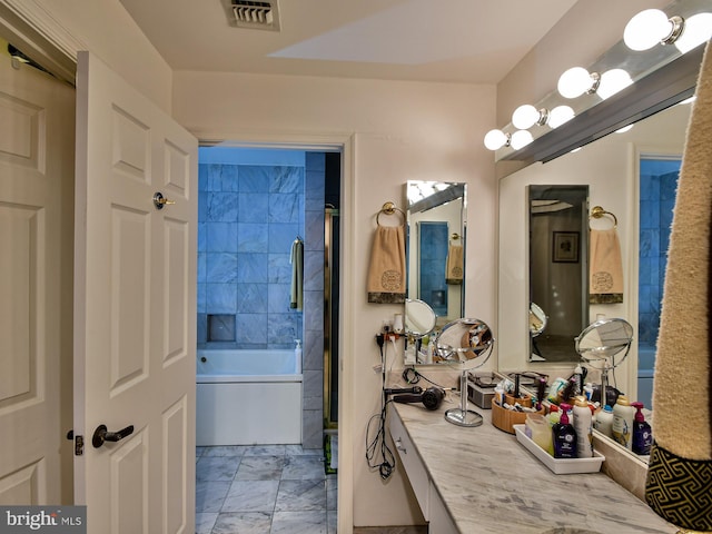 bathroom featuring bath / shower combo with glass door, vanity, and tile floors