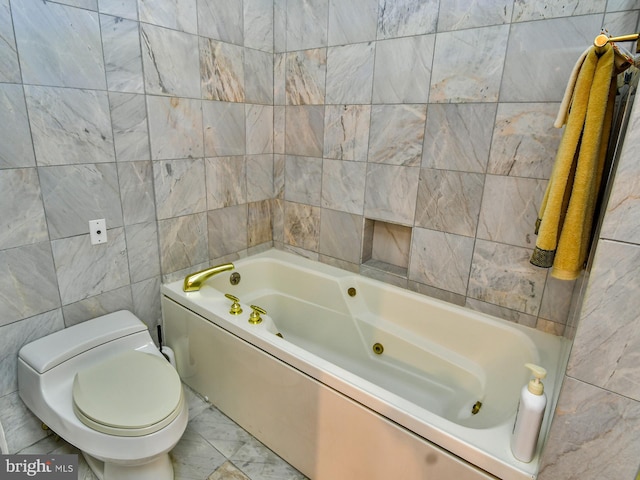 bathroom with tile walls, toilet, and tile flooring