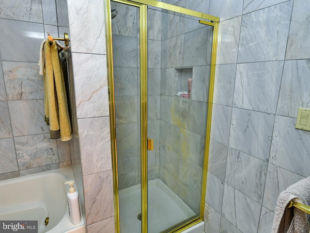 bathroom featuring separate shower and tub