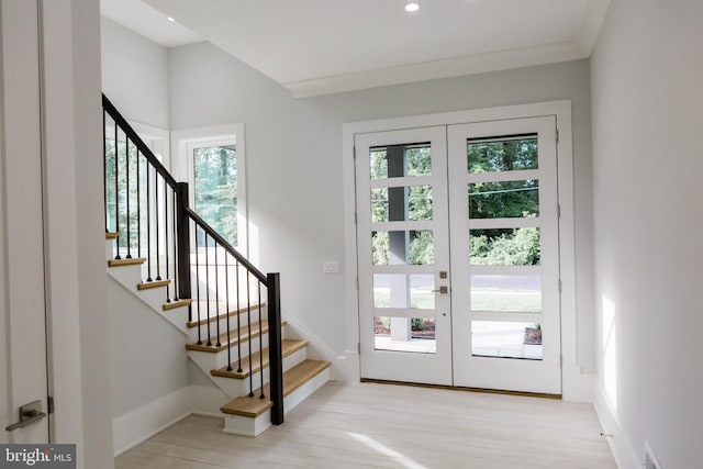 interior space with light hardwood / wood-style flooring, plenty of natural light, and french doors