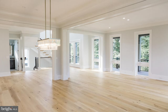 interior space with light wood-type flooring and a healthy amount of sunlight