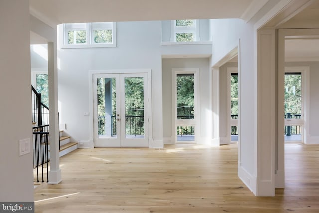 interior space with plenty of natural light and light hardwood / wood-style flooring