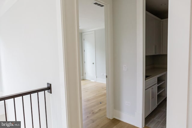 corridor with light wood-type flooring