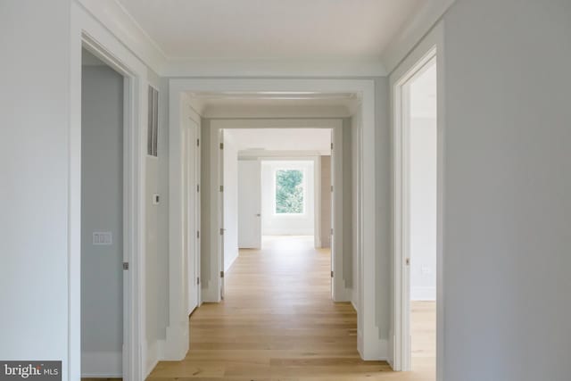 corridor with light wood-type flooring