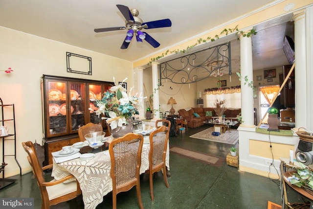 dining room with decorative columns and ceiling fan