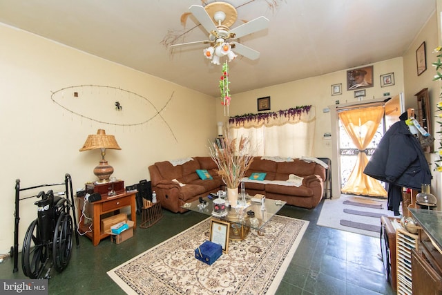 tiled living room with ceiling fan