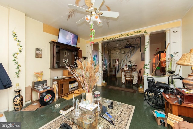 interior space with ceiling fan