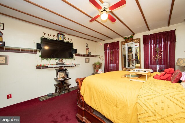 bedroom with carpet, ceiling fan, and beamed ceiling