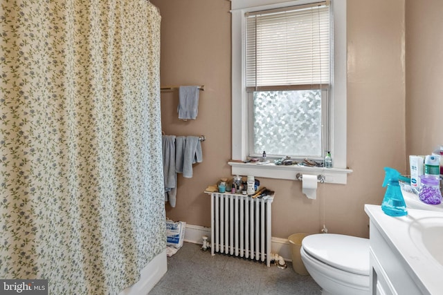 bathroom featuring radiator heating unit, toilet, tile flooring, and vanity