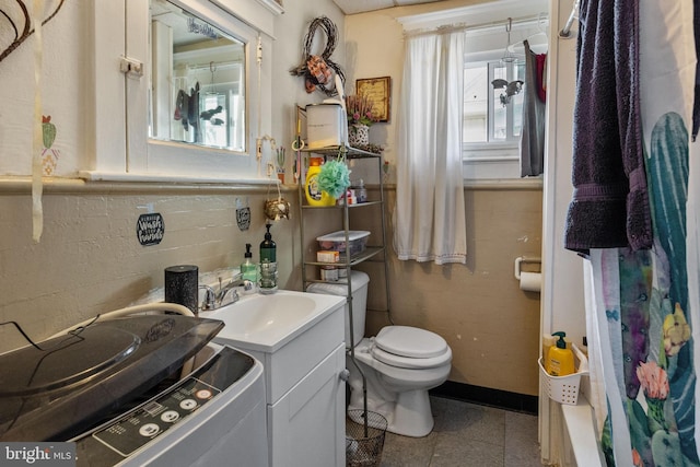 full bathroom featuring tile flooring, large vanity, toilet, and shower / bath combo