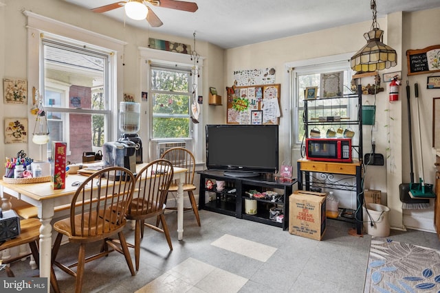 office space featuring light tile floors and ceiling fan