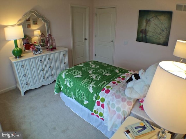 bedroom featuring light colored carpet