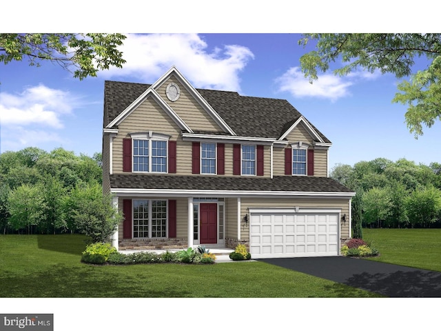 view of front facade featuring a front yard and a garage