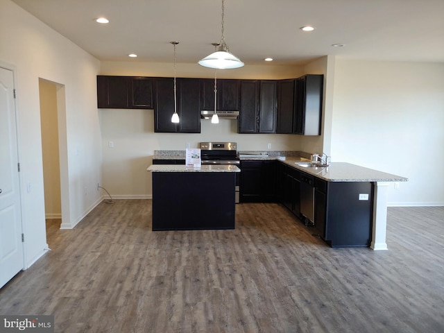 kitchen with light hardwood / wood-style floors, stainless steel electric range, pendant lighting, light stone countertops, and dishwasher