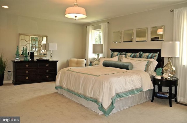 bedroom featuring light colored carpet