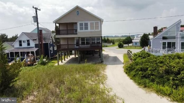 rear view of house with a balcony