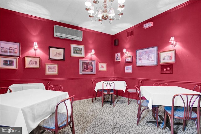 dining space with a chandelier, an AC wall unit, ornamental molding, and light colored carpet