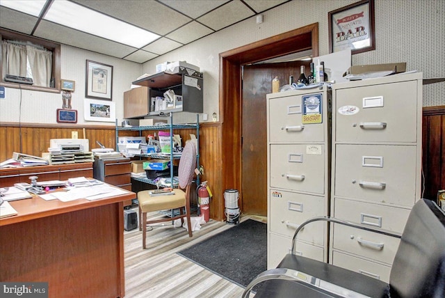 office with a paneled ceiling and light wood-type flooring