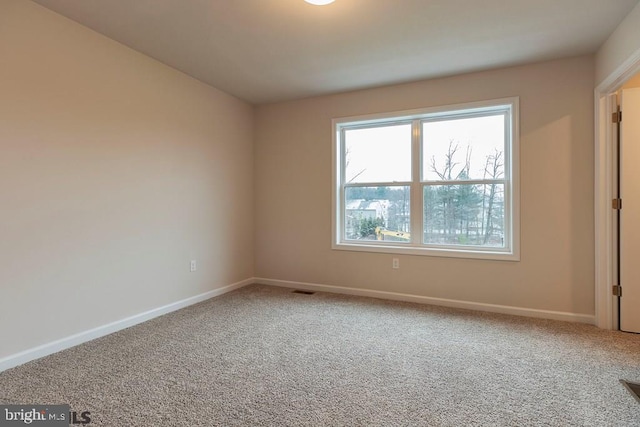 view of carpeted spare room