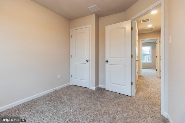 unfurnished bedroom featuring carpet floors