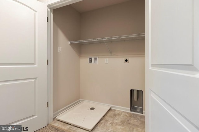 laundry area with hookup for a washing machine, hookup for an electric dryer, and light tile floors