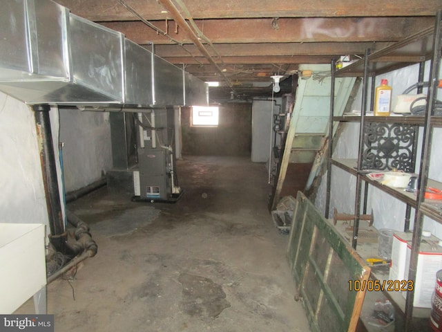 basement featuring heating utilities