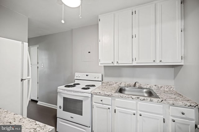 kitchen featuring white cabinetry, ceiling fan, white appliances, sink, and dark tile flooring