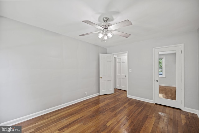 unfurnished room featuring ceiling fan and dark hardwood / wood-style floors