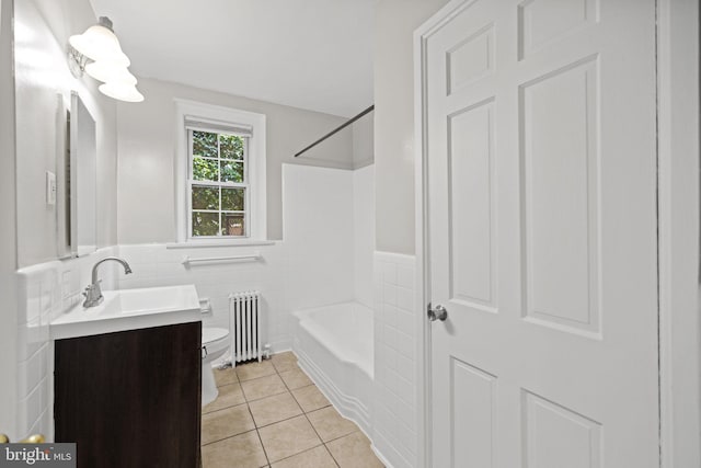 full bathroom featuring toilet, vanity, tile walls, shower / bathtub combination, and radiator heating unit