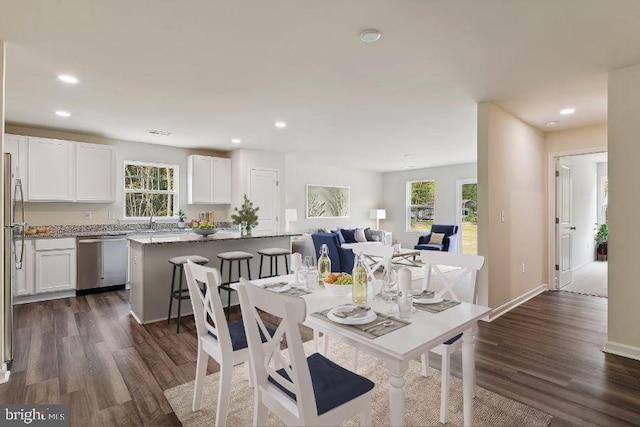 dining space featuring dark hardwood / wood-style flooring