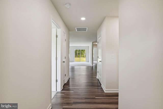 hallway featuring dark hardwood / wood-style flooring