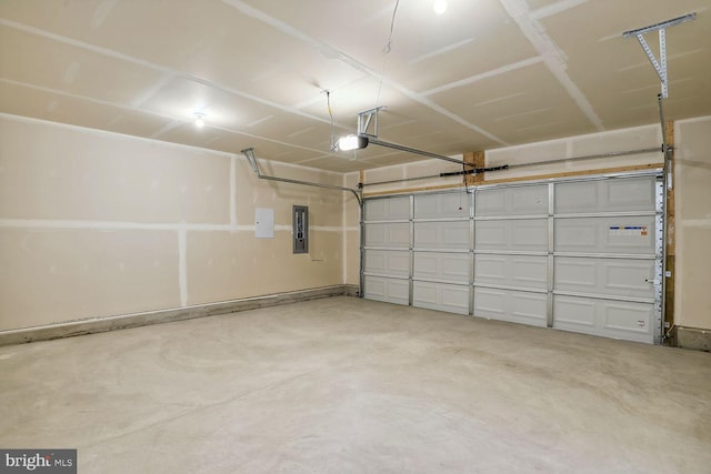 garage featuring a garage door opener and electric panel