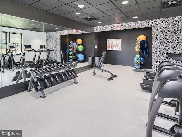 gym featuring a paneled ceiling, recessed lighting, visible vents, an accent wall, and wallpapered walls