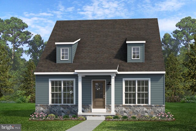 cape cod home featuring stone siding, a shingled roof, a front lawn, and covered porch