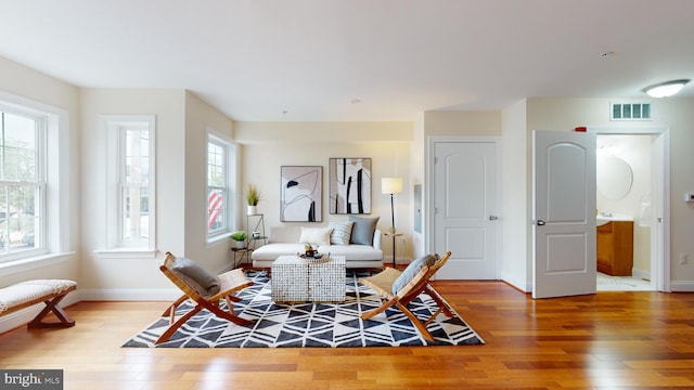 sitting room with light wood-type flooring