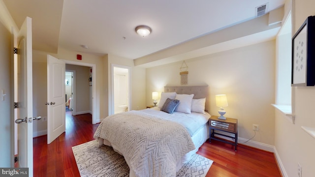 bedroom featuring dark hardwood / wood-style floors