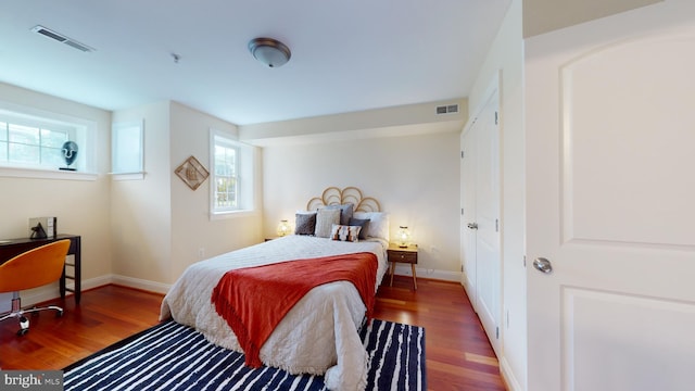 bedroom featuring dark wood-type flooring