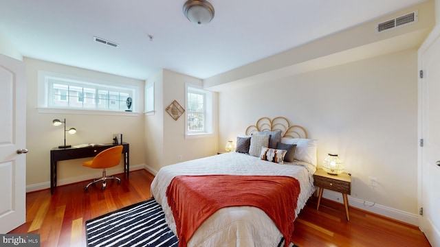 bedroom featuring dark hardwood / wood-style flooring